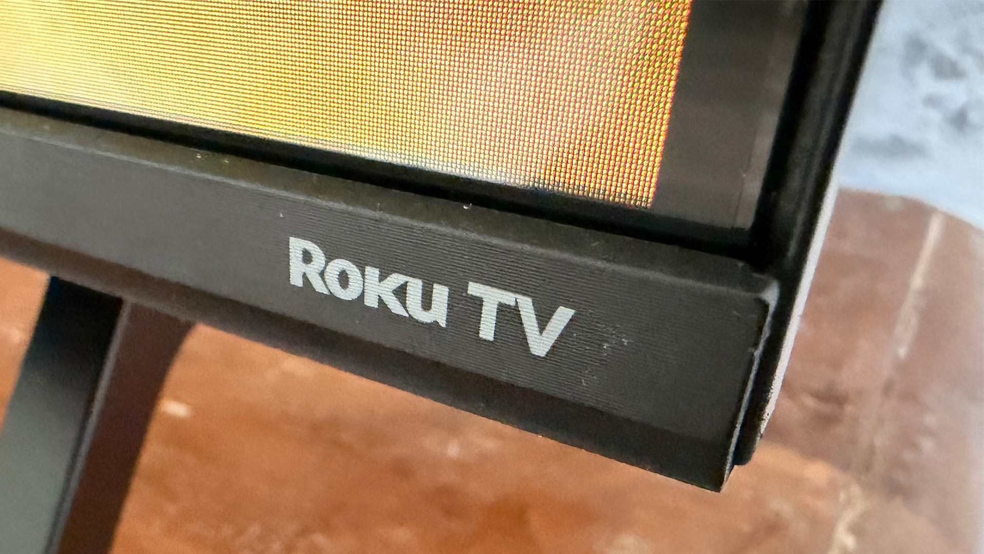 Sharp HJ6725K QLED TV bottom right edge showing Roku TV logo