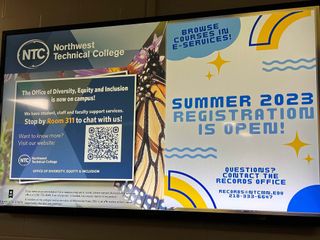 Digital signage displaying important updates at Northwest Technical College.