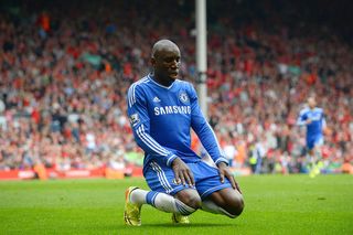 Chelsea's French-born Senegalese striker Demba Ba celebrates after scoring the opening goal during the English Premier League football match between Liverpool and Chelsea at Anfield Stadium in Liverpool, northwest England, on