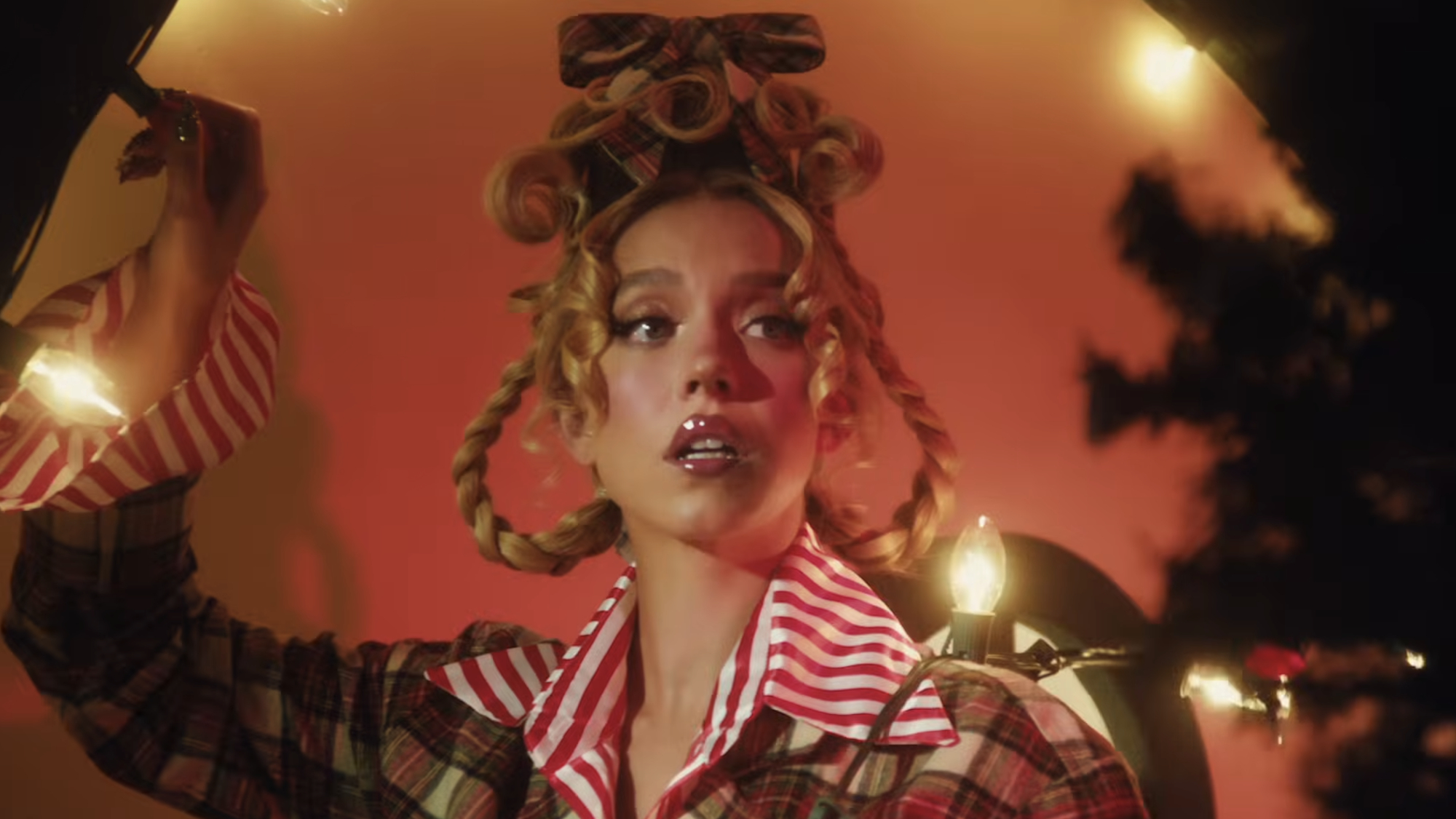 Sydney Sweeney portrays Cindy Lou Who from How the Grinch Stole Christmas in a new ad for her SYRN brand.