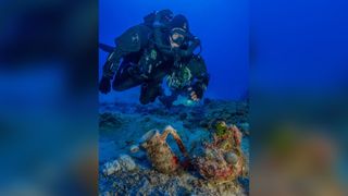 An archaeologist swims over artifacts at the site of the Antikythera shipwreck. The site is famed for the massive amount of artifacts discovered there. Case in point: In 2015, researchers pulled up 50 objects from the depths as part of their scientific excavation of the Antikythera wreck site.