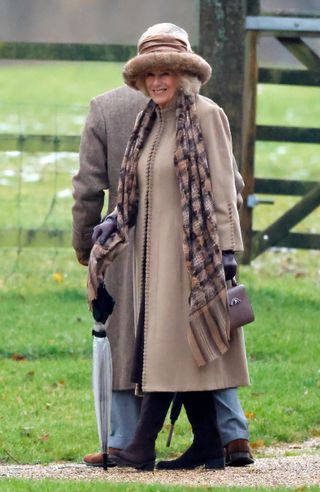Queen Camilla wears furry hat at the Sandringham Estate
