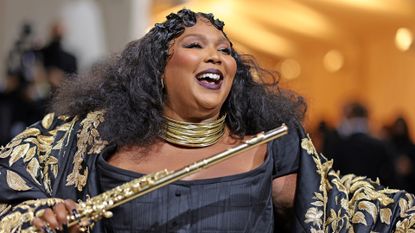 lizzo at the met gala laughing 