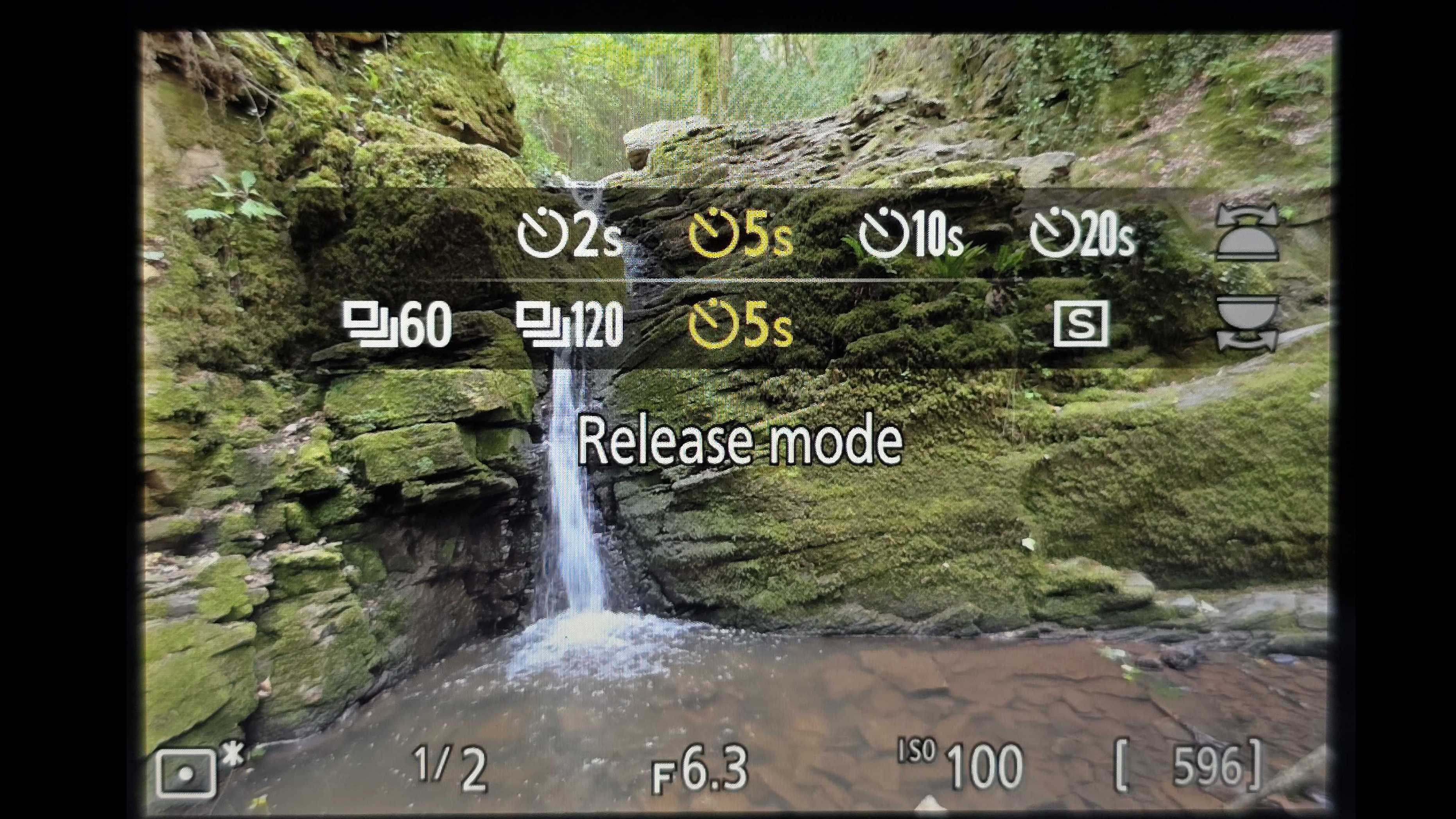 Either use a release cable, an app, or set a delay in camera
