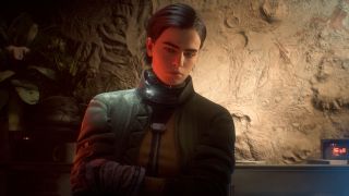 Arc Raiders: An upper-body shot of Celeste standing next to a sandstone wall, looking downwards as if deep in thought.