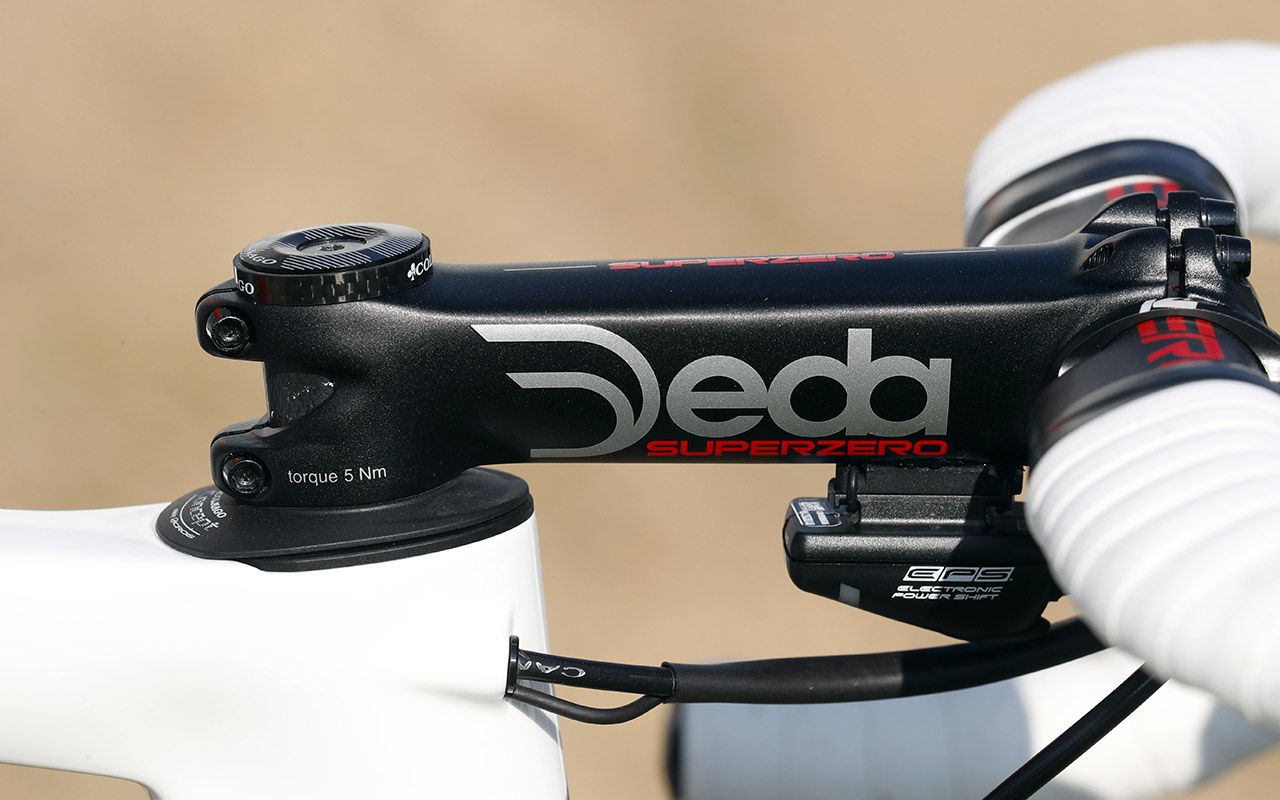 The Colnago is paired with an alloy Deda Super Zero stem and cockpit
