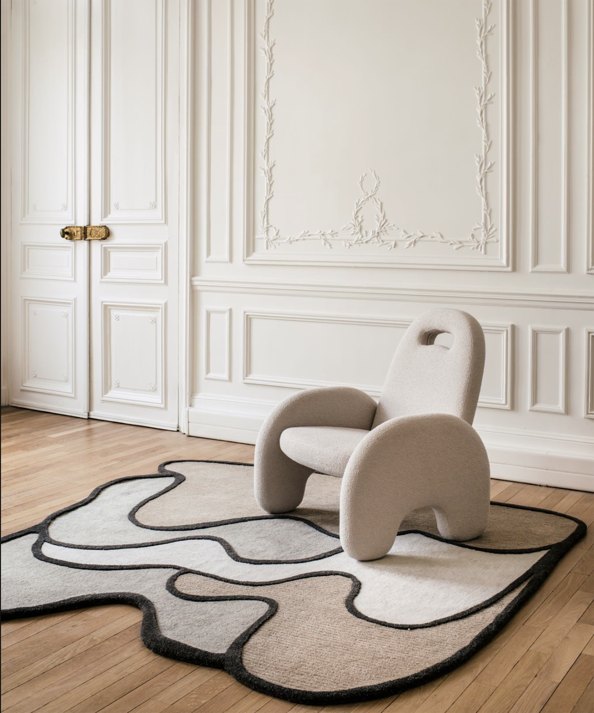 graphic irregular rug on the floor of a white room