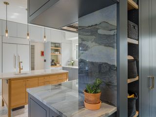 range wall in marble with hidden storage at the back