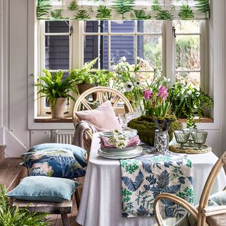 botanical country dining room with fern print blinds and pot plants