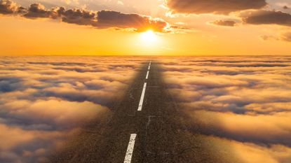 Road in the clouds. Paradise concept.