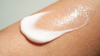 Smear of sunscreen on woman's arm