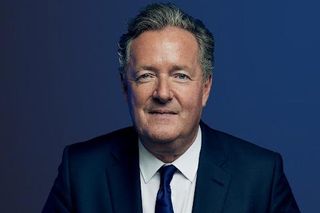 TalkTV host Piers Morgan against a blue background.