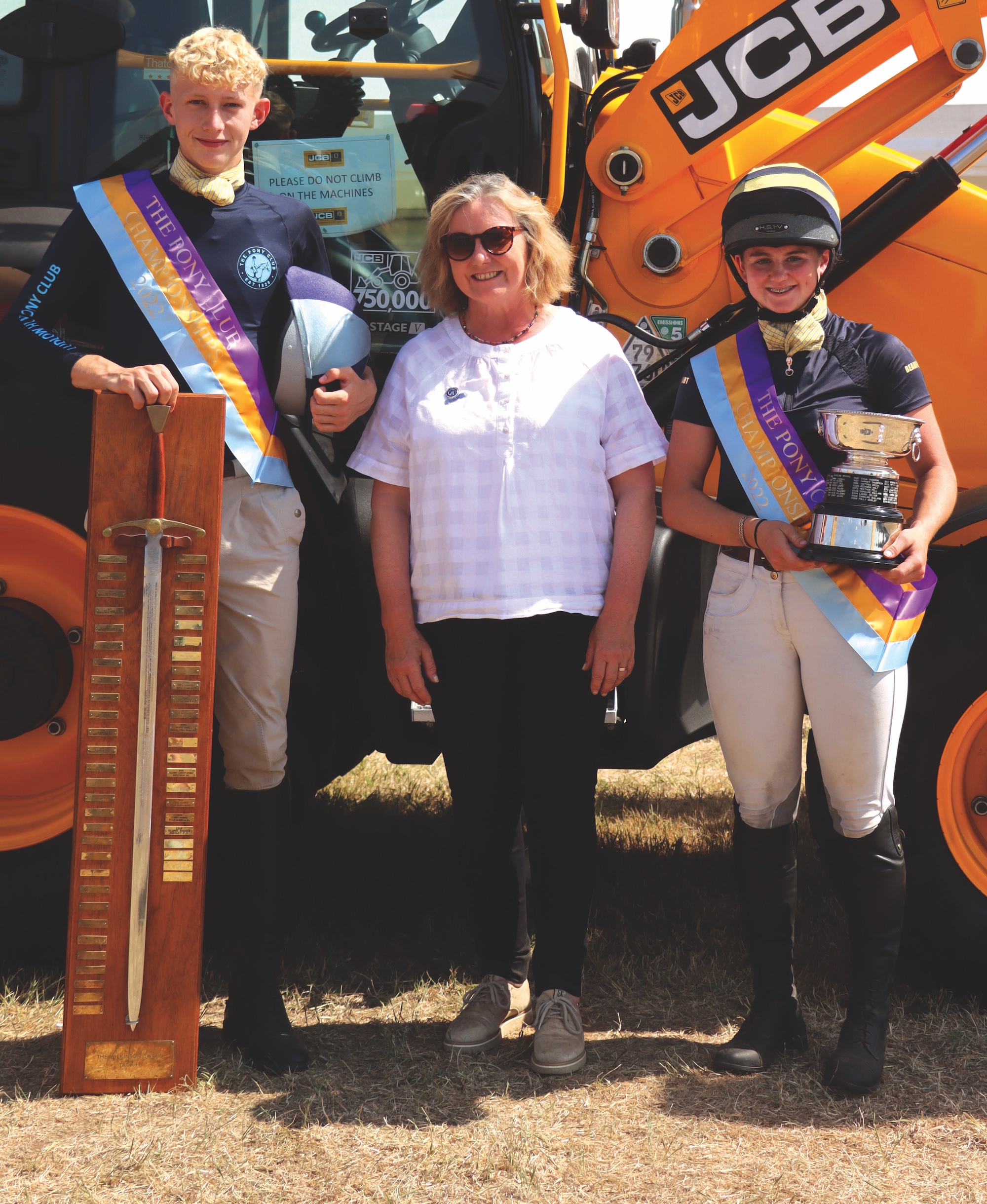Two tetrathlon champions collecting their trophies