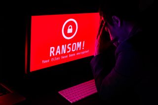 Red computer screen with "RANSOM!" on it