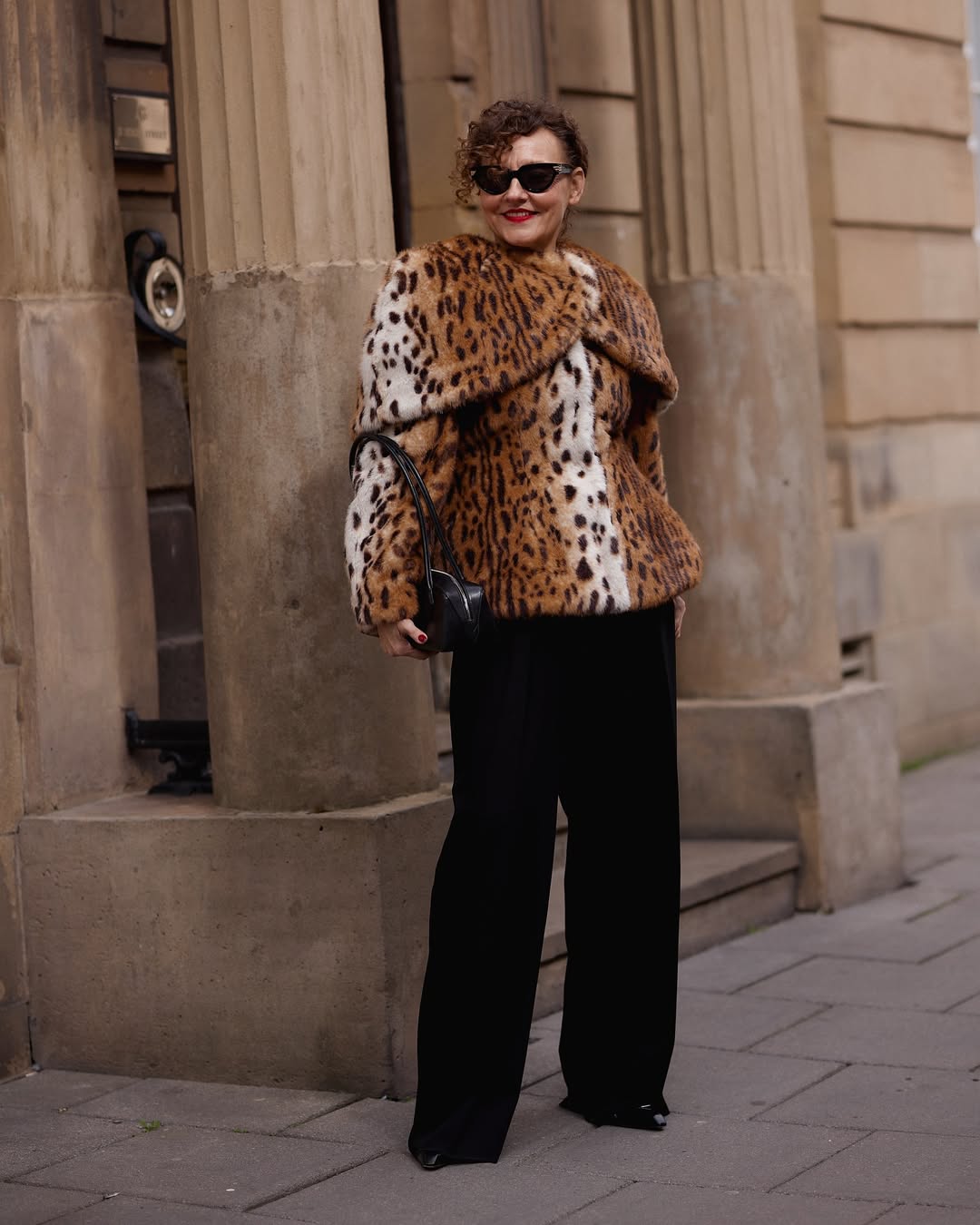 @venswifestyle wearing an animal print jacket and trousers