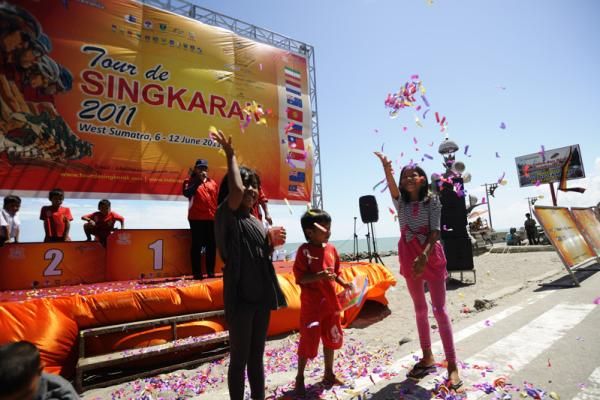 Local children were playing with confetti of many colors