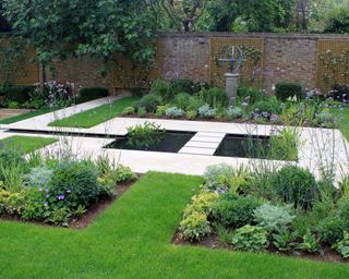 Garden pool design in a Highgate walled garden by Peter Reader Landscapes
