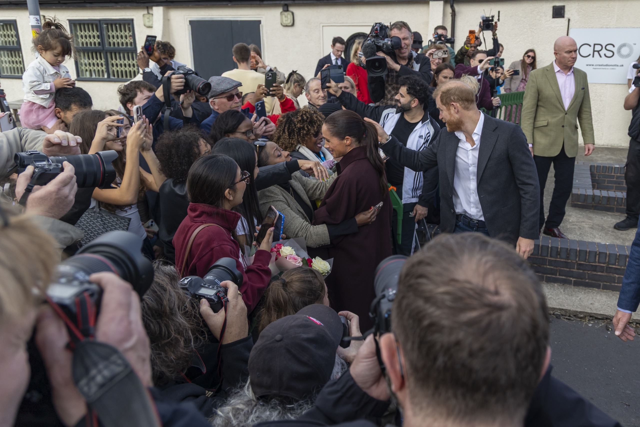 Prince Harry and Meghan Markle greeting fans in Nottingham, England