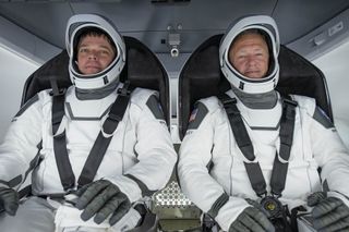 NASA astronauts Bob Behnken (left) and Doug Hurley participating in a preflight test for the Demo-2 mission, which included flight suit leak checks, spacecraft inspections and more.