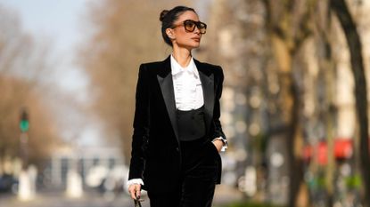 Heart Evangelista wearing a lack tuxedo and brown sunglasses in Paris