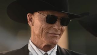 Everett wearing black cowboy hat and sunglasses smiling at Beulah in Dutton Ranch Season 1