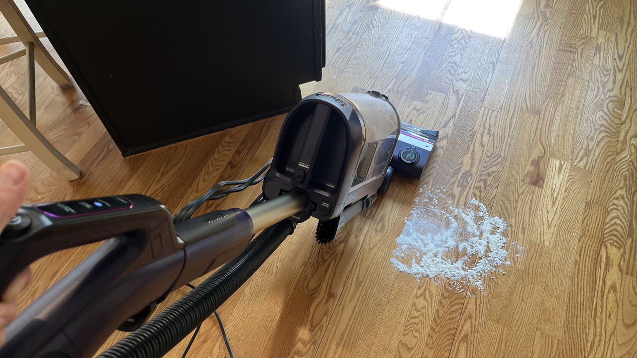 Shark POWERDETECT Upright Vacuum vacuuming flour and sugar on wooden floor