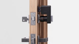 SwitchBot Smart Lock attached to door