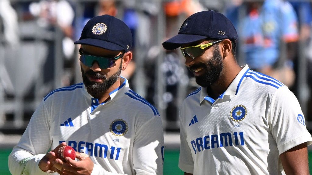 India&#039;s Virat Kohli (L) and Jasprit Bumrah talk on day four of the first Test cricket match between Australia and India at Optus Stadium ahead of the 2nd Test Australia vs India