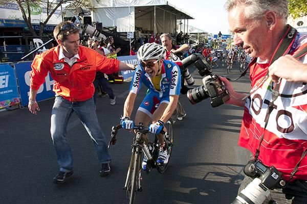 Giorgia Bronzini (Italy) is escorted to the mix zone after her thrilling win in the women's road race.