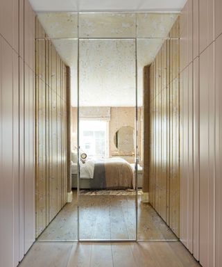 Hidden mirrored door connecting a bedroom and an en suite