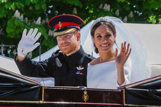 Prince Harry and Meghan Markle in the carriage after their wedding ceremony