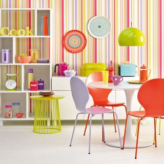 kitchen area with candy strip wall and dining table