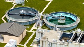 Aerial view of water treatment factory at city wastewater cleaning facility