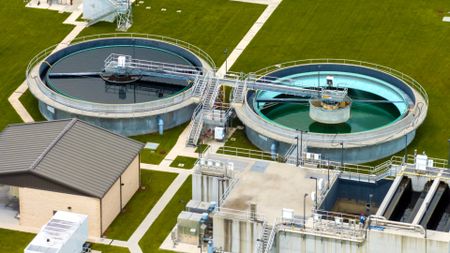 Aerial view of water treatment factory at city wastewater cleaning facility