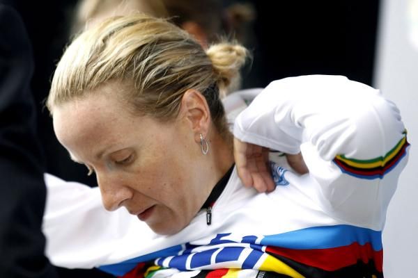 Judith Arndt pulls on her rainbow jersey