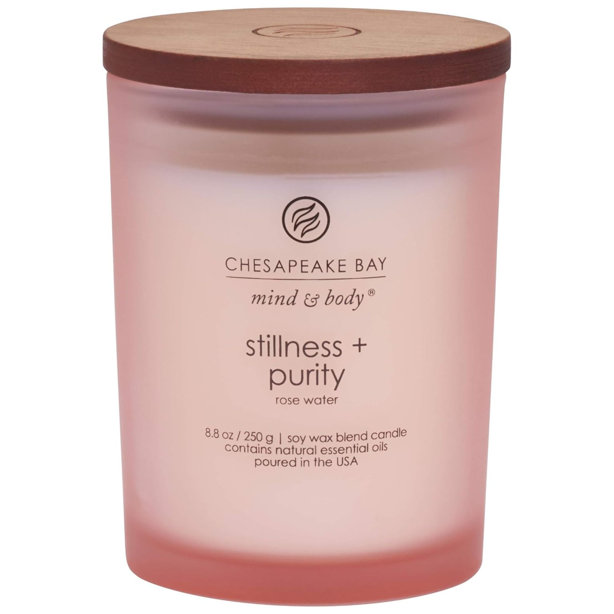Chesapeake Bay Candle Scented Candle Stillness + Purity in a pale pink glass vessel with a brown wooden lid