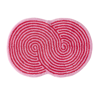 A pink figure eight bath mat