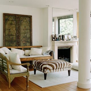 living room with wooden floor and mirror