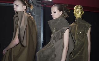 3 Female models dressed Rick Owens A/W 2015 collection bacstage of the fsahion show