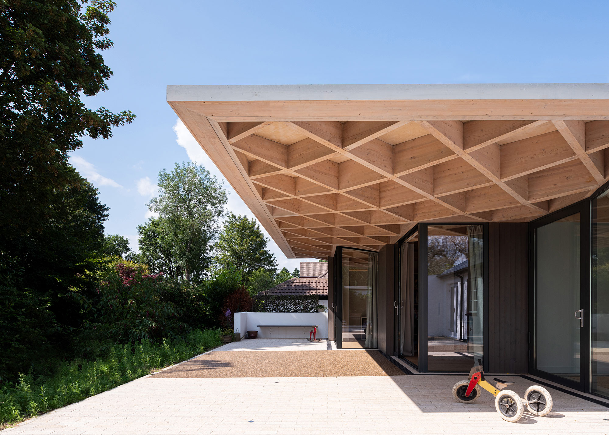 modern single storey house with large timber overhang
