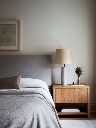A bedroom with varying textured pieces