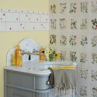 bathroom with wash basin and floral tiles