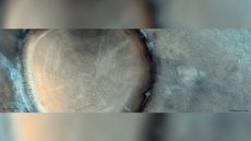 This image from CaSSIS aboard the ExoMars TGO reveals an impact crater on Mars that looks like a tree stump.