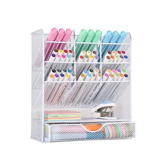A white pen organizer with pens in it
