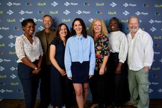 The cast of Payback posing for a photo