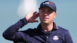 Justin Thomas holds his hand up to his ear at the 2021 Ryder Cup