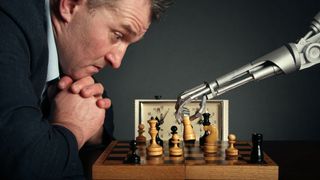 A man playing chess with a robot.