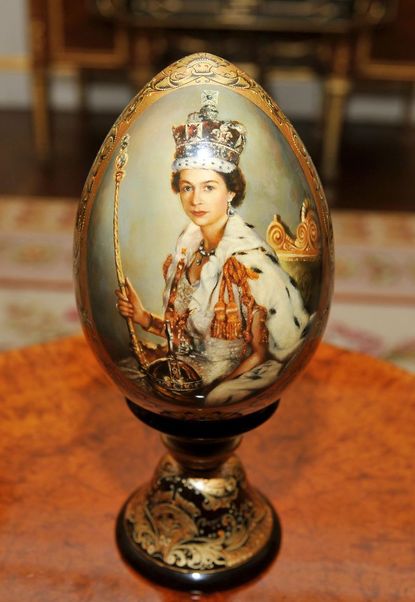 An ornate wooden portrait egg