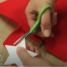 red star shape paper with scissor
