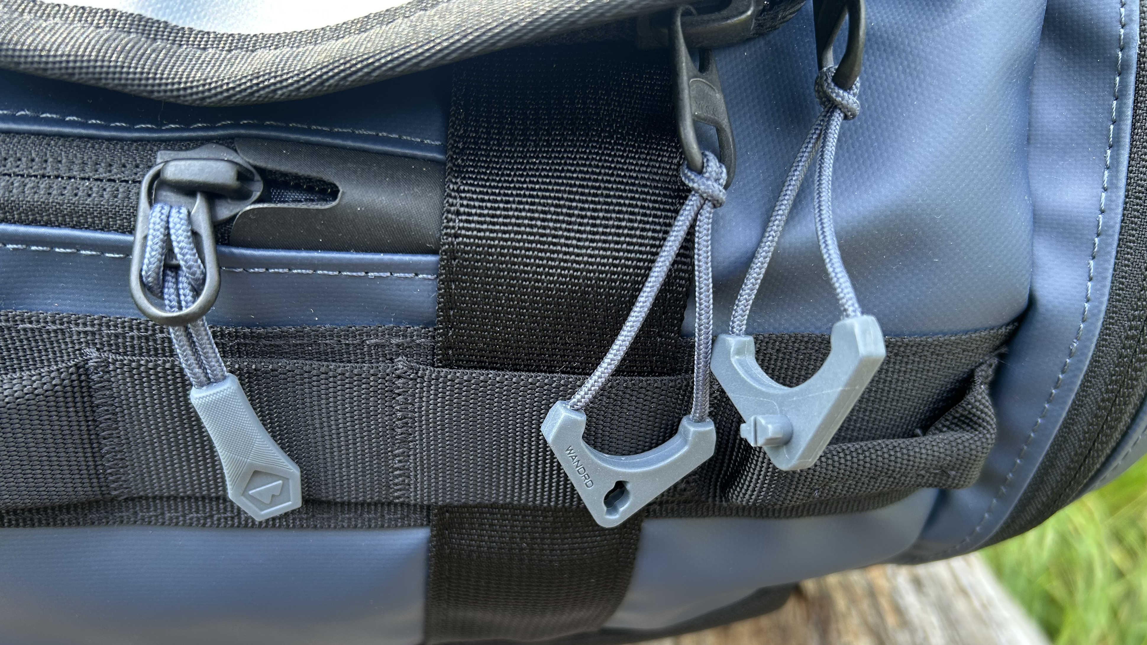 Worryless Locking Zipper Pullers on the Wandrd Carryall Duffel